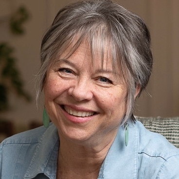 Meditation teacher hugging a student