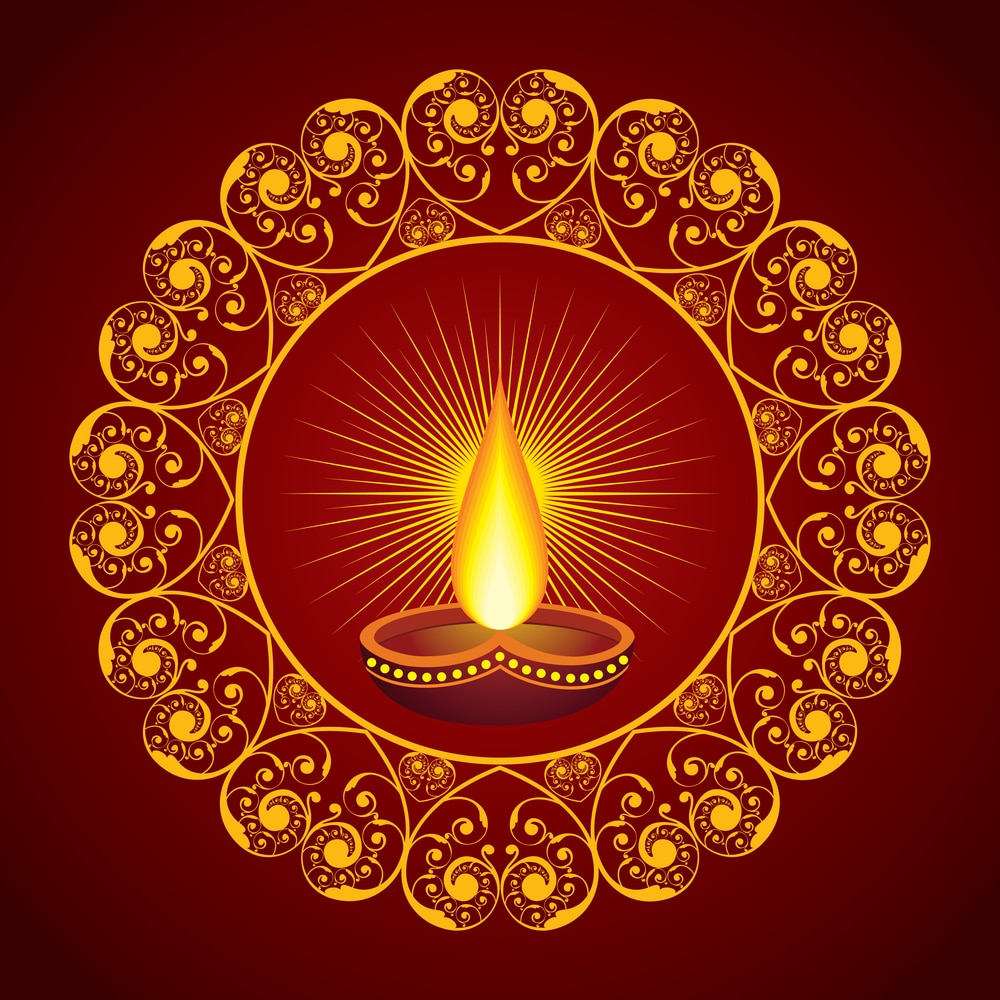 Group of advanced meditators smiling in a namaste pose